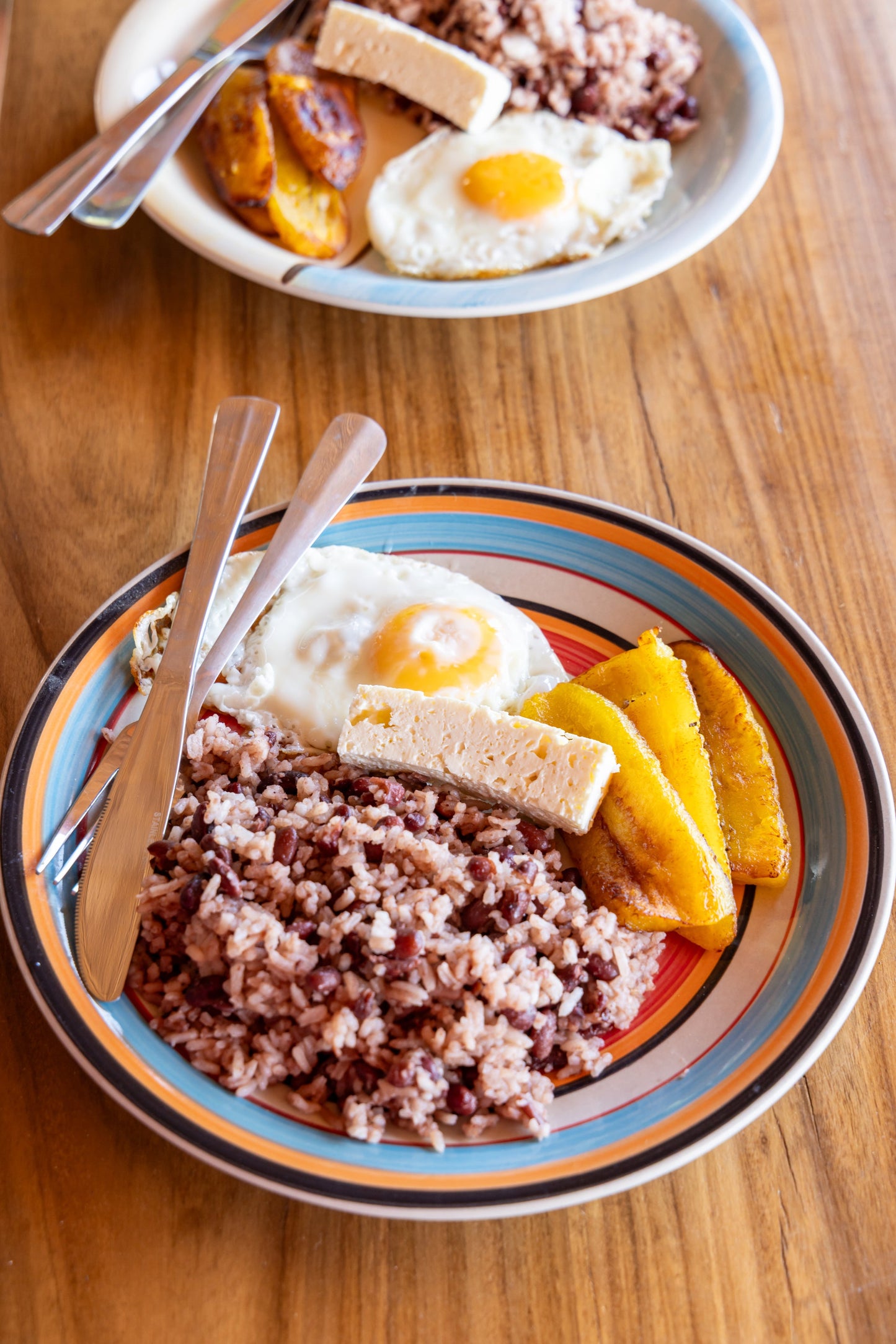 Nicaraguan breakfast with gallo pinto, egg, cheese and plantain